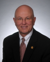 Representative Les "Skip" Carnine (R)